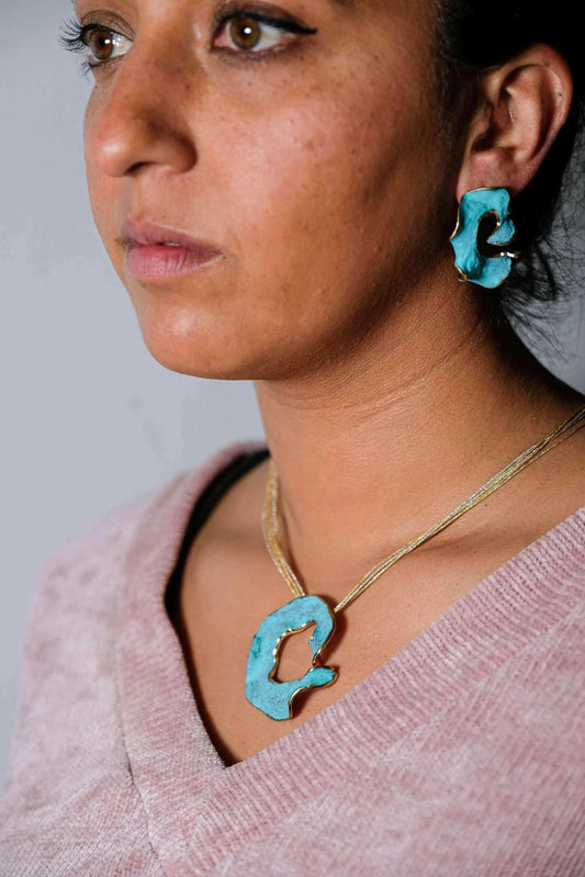 Eterna C Earrings in gold-plated metal with sculptural design