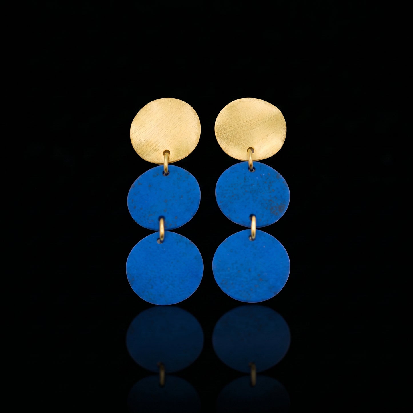 Gold-tone triple motion drop earrings with three blue discs
