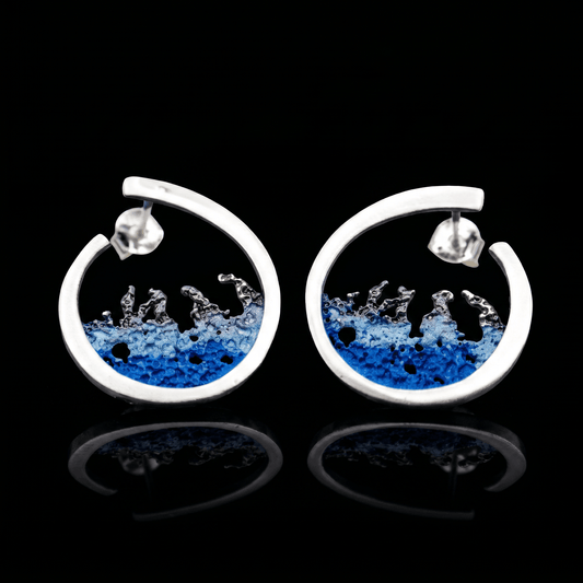 Silver hoop earrings with blue resin splash design