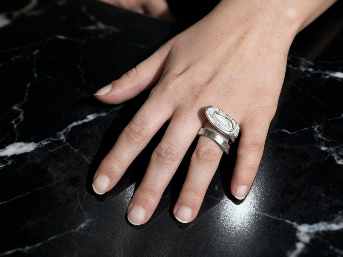 Silver Echo Ring worn on the hand, showing sculptural volume and texture