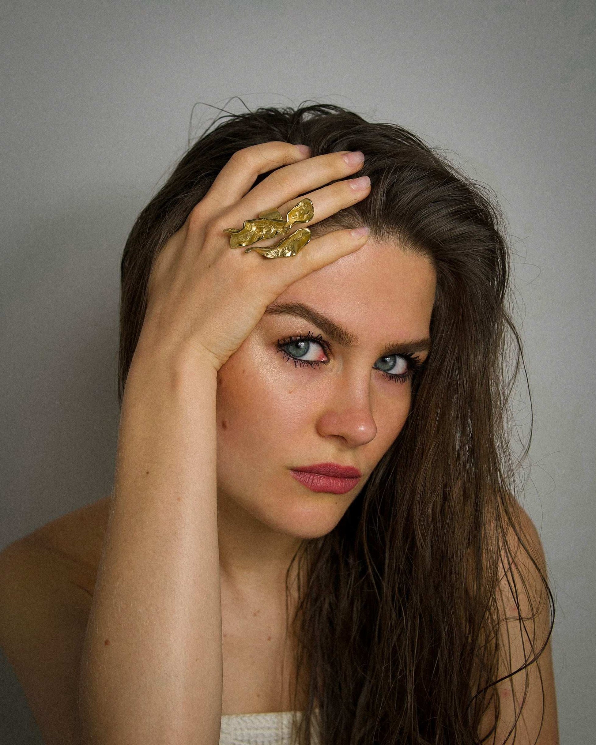 18K gold wave ring worn on hand, irregular wavy textured band