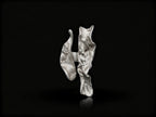 Silver open ring with textured wave design and polished highlights.