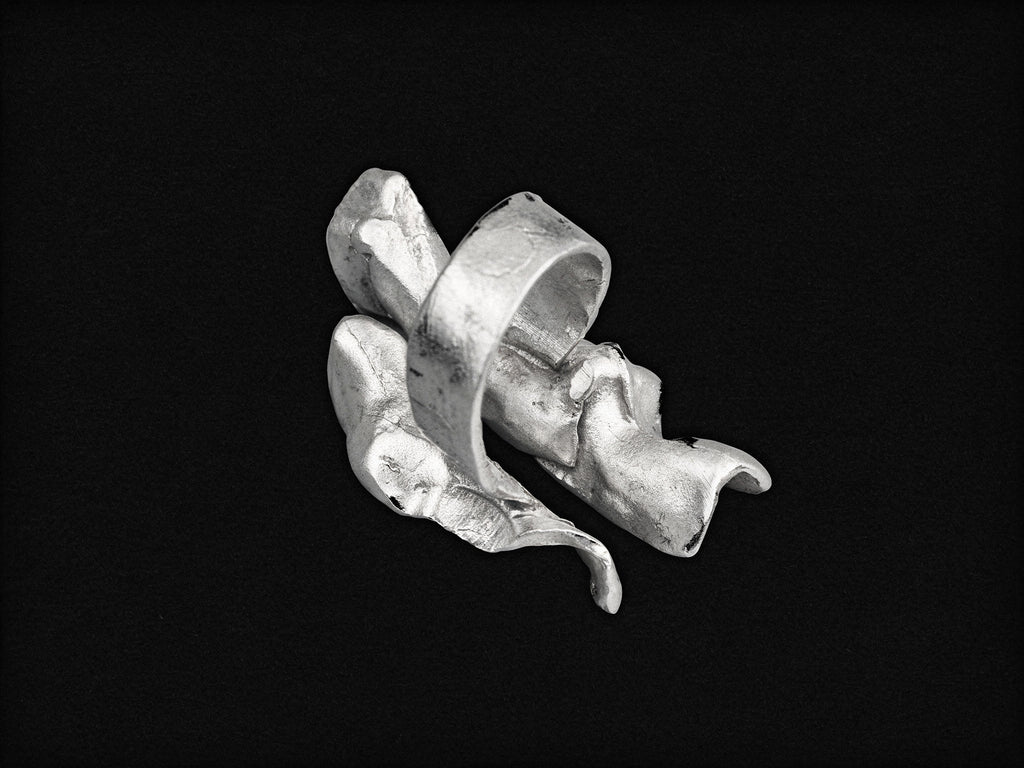 Silver wave open ring, sculpted band with raised leaflike ridges.