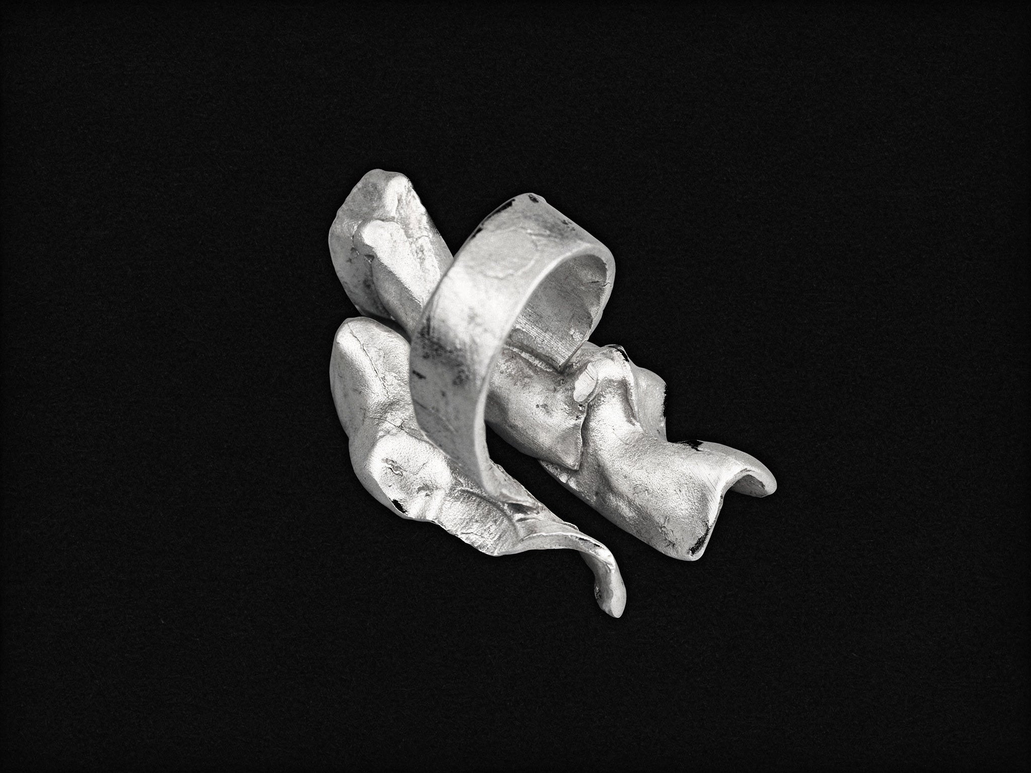 Silver wave open ring, sculpted band with raised leaflike ridges.