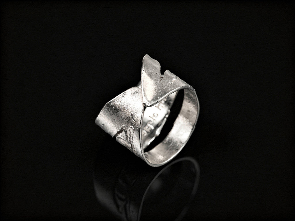 925 sterling silver ring, front view with sculpted overlapping bands and hollow cutout