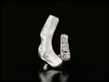 Sterling silver ring with open cuff design and rough textured centerpiece