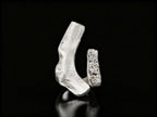 Sterling silver ring with open cuff design and rough textured centerpiece