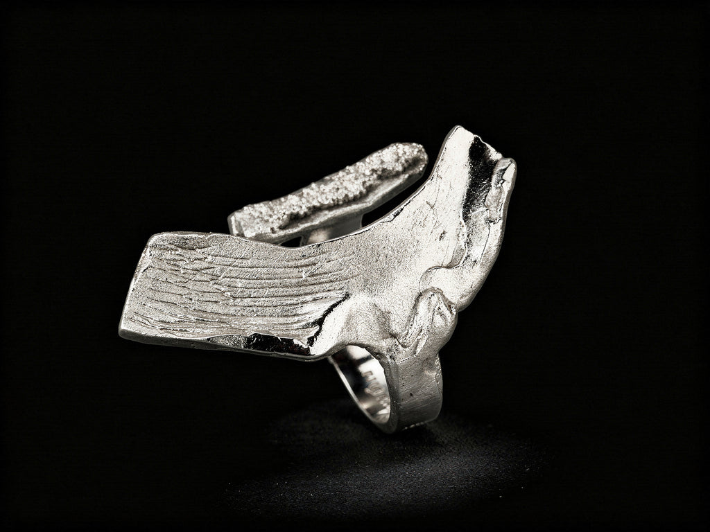 Sterling silver ring with sculpted cuff band and textured top bar detail