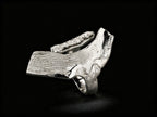 Sterling silver ring with sculpted cuff band and textured top bar detail