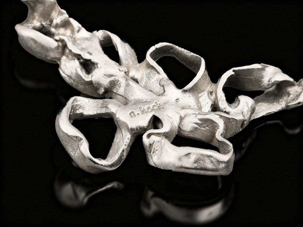 Silver coral-style pendant centerpiece with open ring loops and hammered texture
