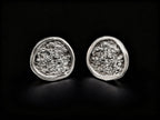 925 sterling silver oval stud earrings with textured center and polished edge