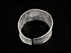 Silver wide cuff bracelet, open ends with centered flat clasp detail