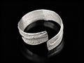 925 sterling silver cuff bracelet with open front and stippled textured finish
