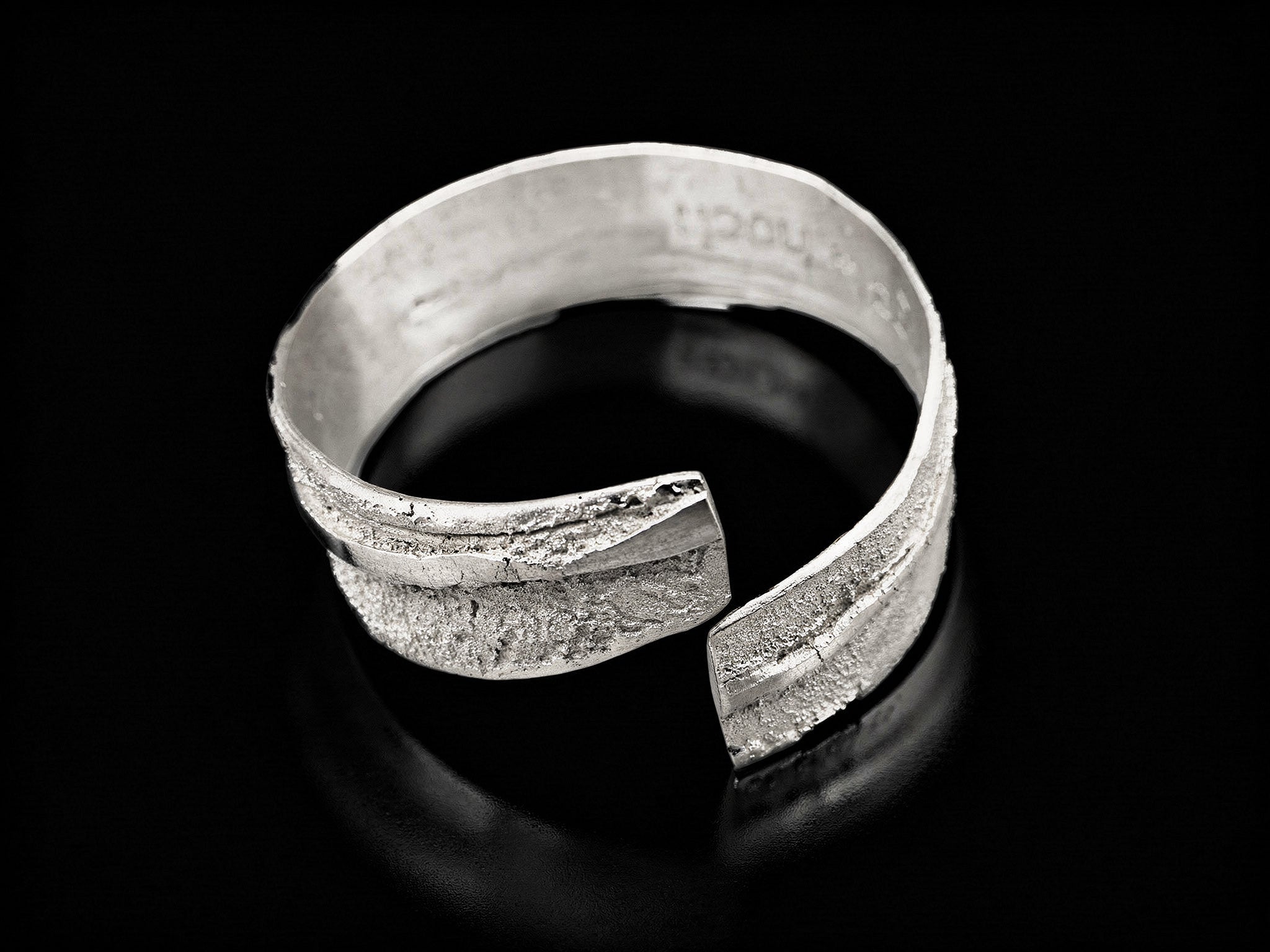 925 sterling silver cuff bracelet with open front and stippled textured finish