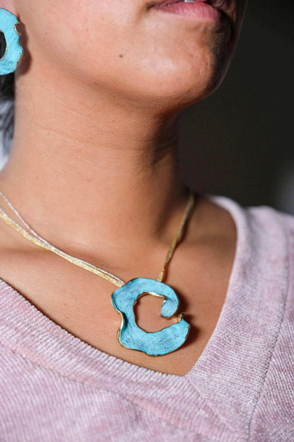 Eternal C Pendant detail showing artisanal texture