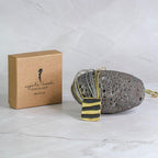 Gold and silver braided cord necklace with rectangular black pendant and 3 gold bars