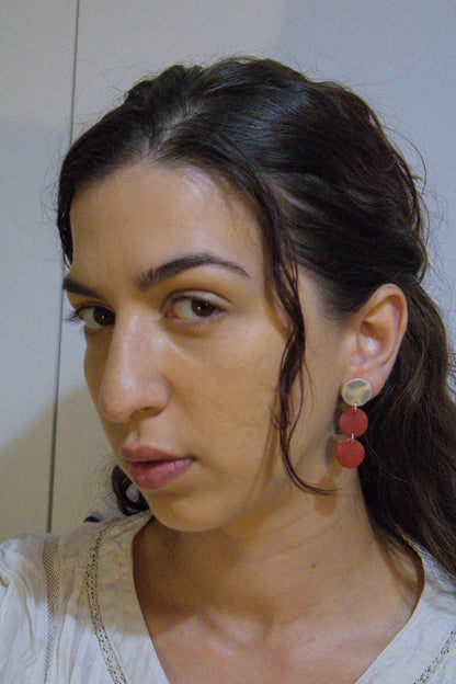 Three-disc motion earrings: gold-tone tops with two stacked red disc drops