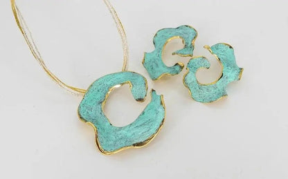 Eterna C turquoise enamel earrings with gold-tone edging, flat lay with chain and pendants