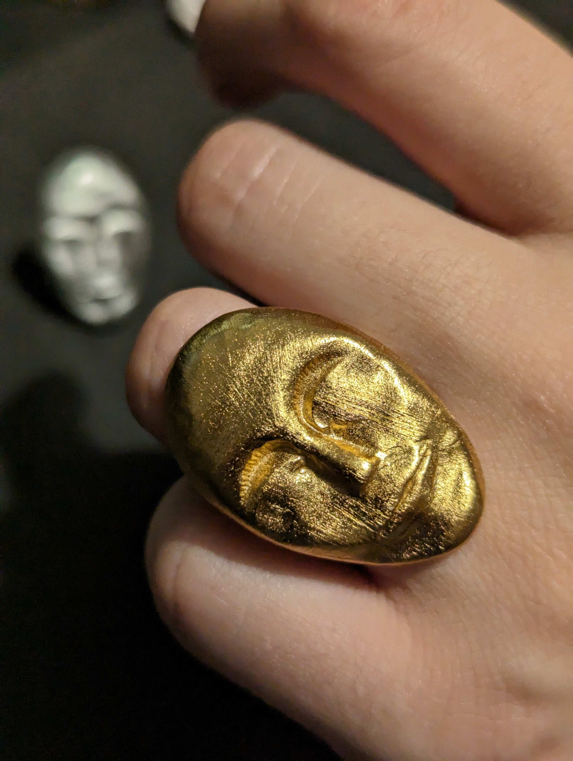 Gold textured face statement ring