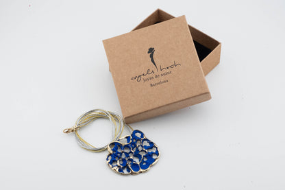 Perforata Lux pendant necklace, blue perforated oval pendant with silver cord and gift box