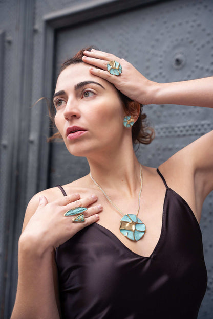 Silver-tone concept necklace with turquoise oval pendant on thin chain