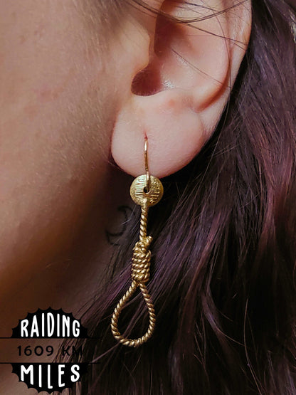 Gold rope-shaped dangle earrings with textured round tops and twisted rope teardrop loops
