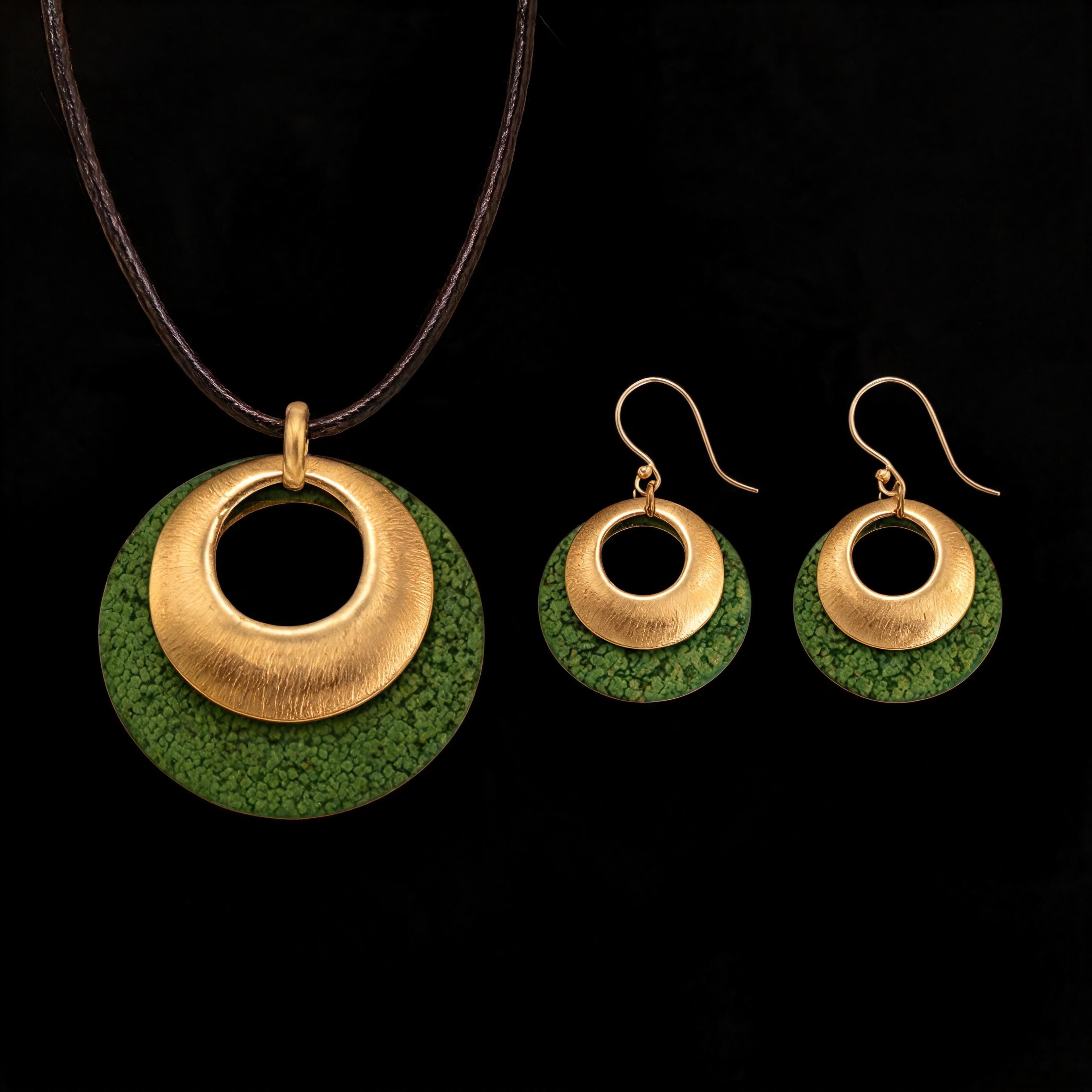 Gold-tone dangle earrings with textured green discs and inner circular studs