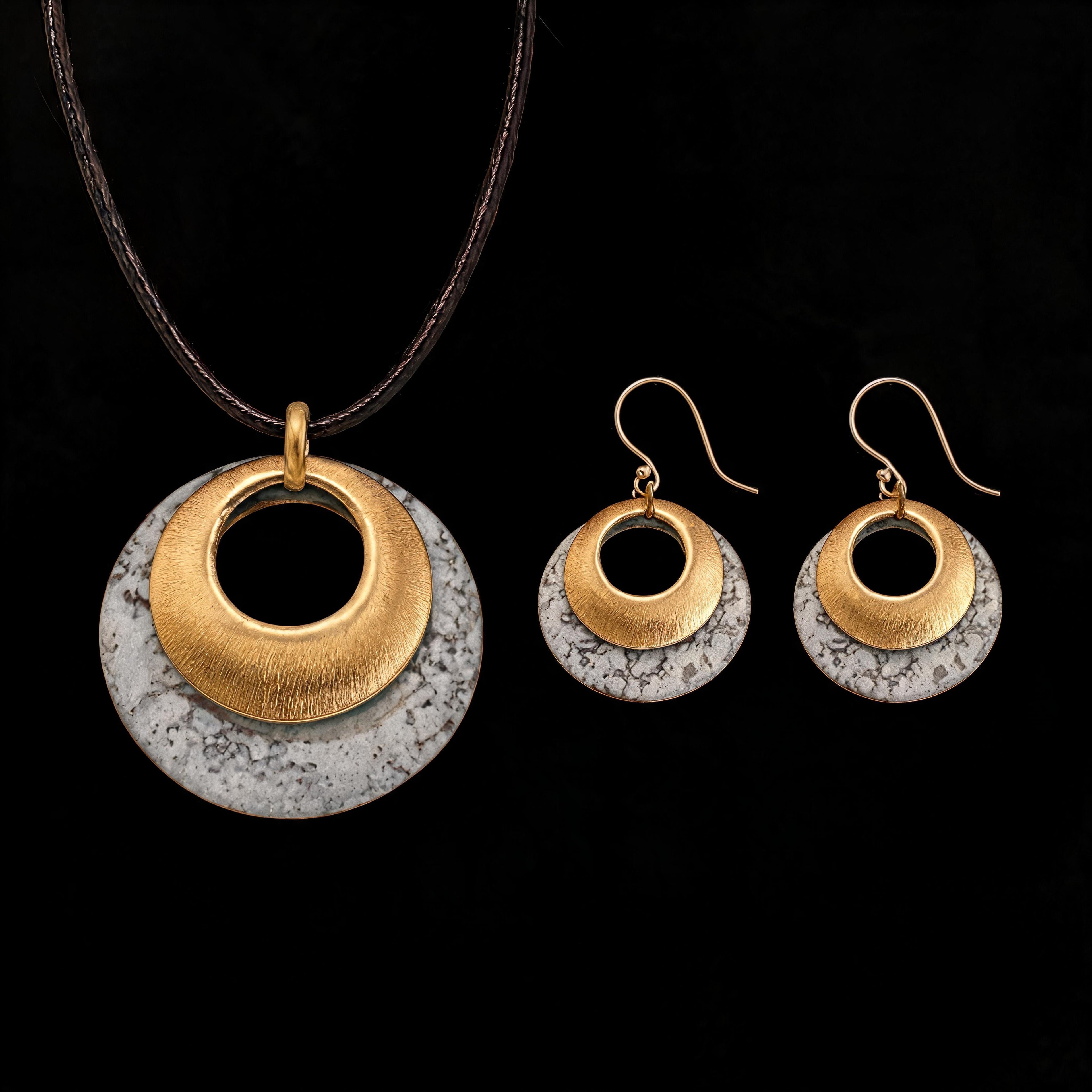 Gold-tone and silver-tone pendant and hoop earrings set with gray textured discs