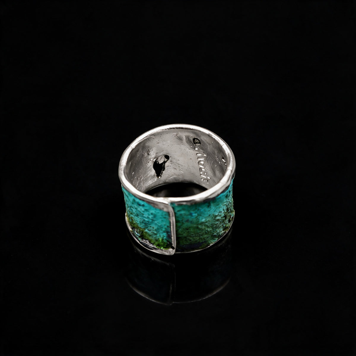 Silver Strata Ring viewed from inside, showing its turquoise-green textured band