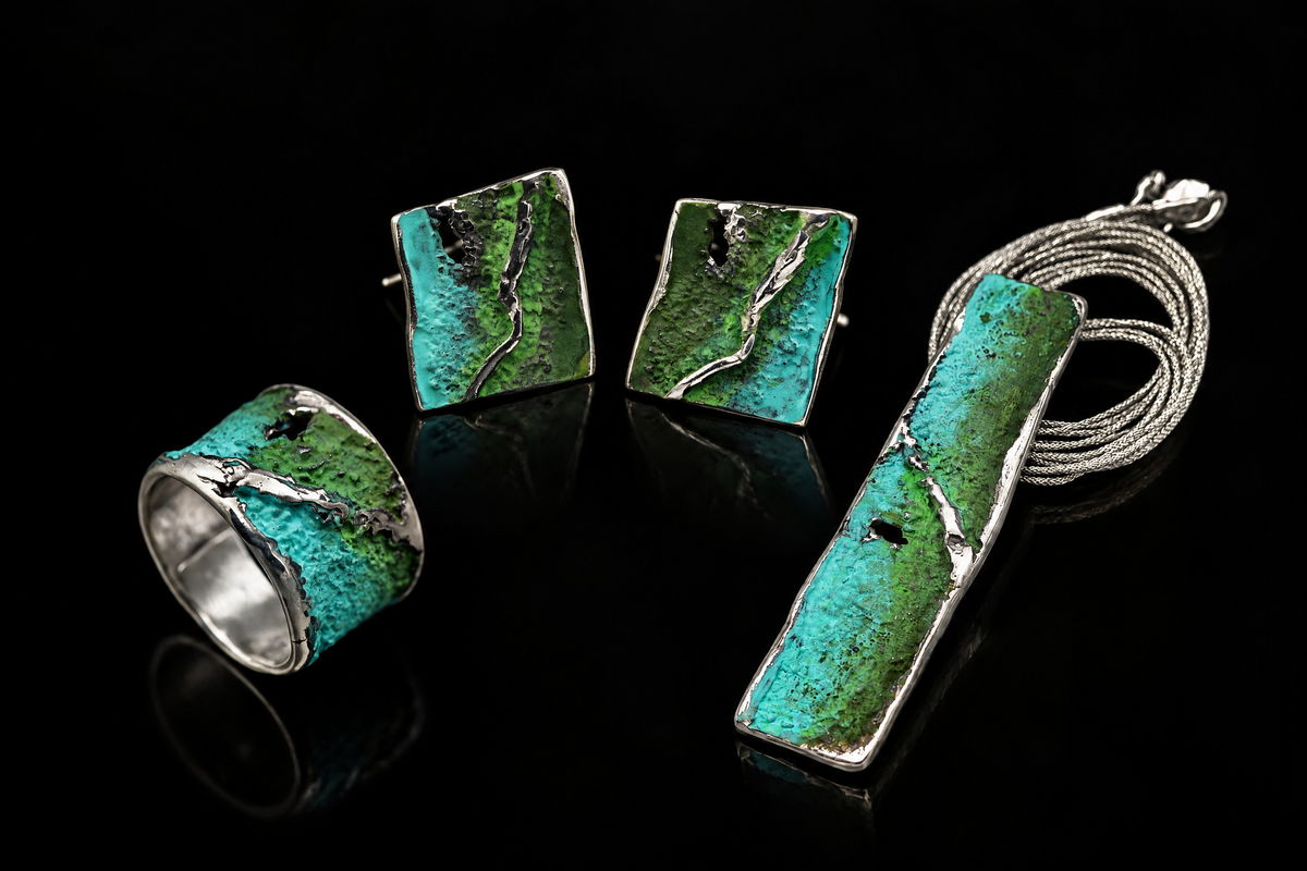 Silver Strata Ring with turquoise-green inlay, shown beside matching earrings and a pendant