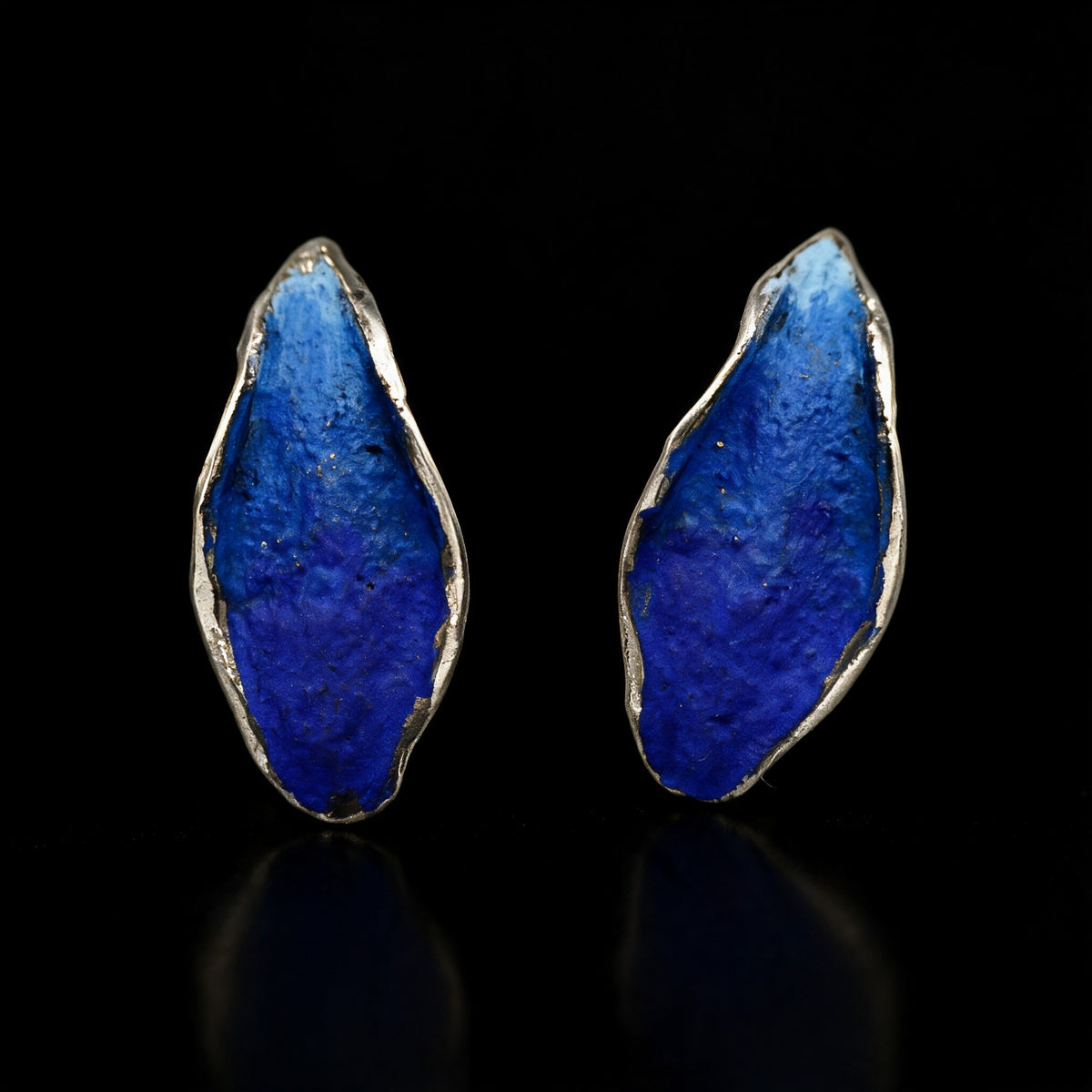 Cobalt blue Silver Echo earrings with irregular stone-like fronts and silver-tone edges