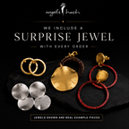 Assorted gold and silver jewelry pieces with surprise jewel banner