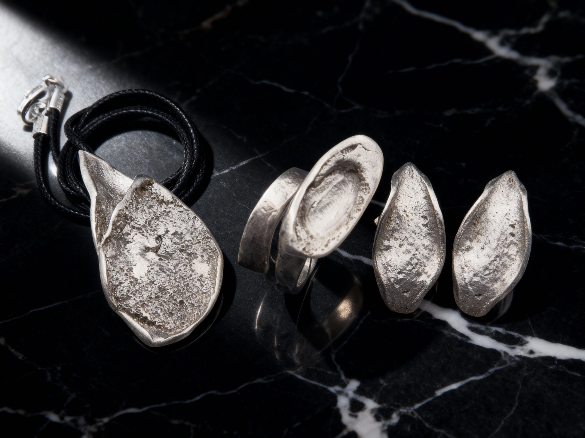 Silver Echo Ring side view with sculptural profile