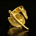 18K gold Gaudi-style ring with textured open oval design