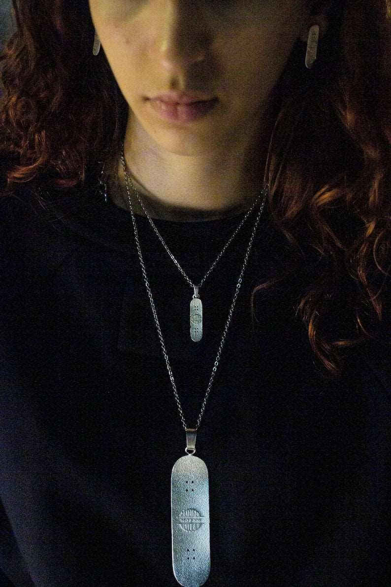Skateboard Necklace side view with sculptural profile