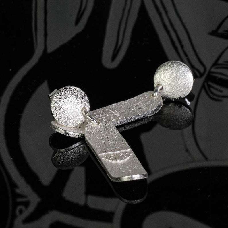 Skateboard Stud Movement Earrings detail showing artisanal texture