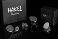 Silver round stud earrings with disc dangle on post, with HAKEL box