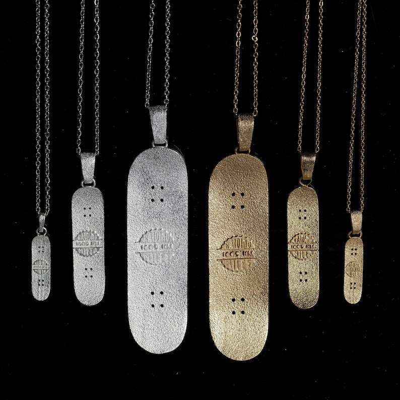 Skateboard Necklace in bronze with minimalist design