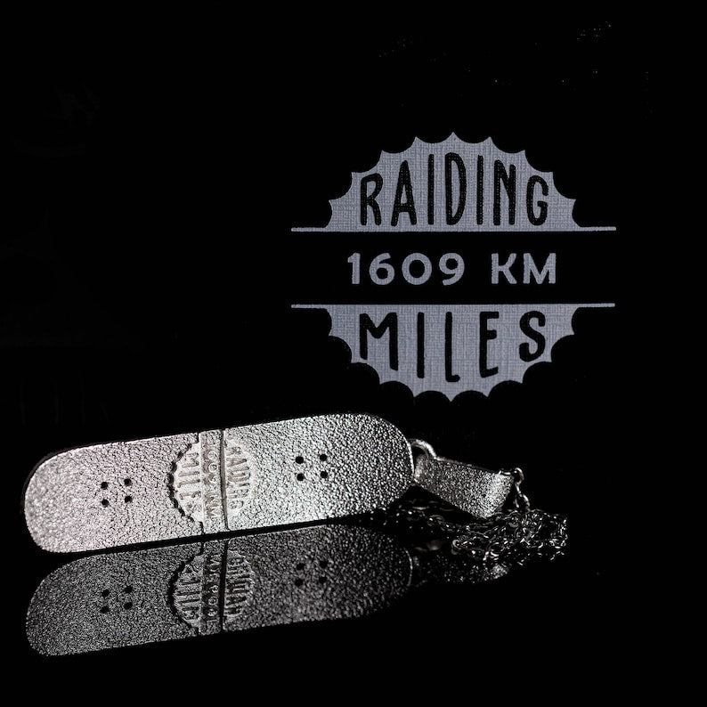 Skateboard Necklace in bronze with minimalist design