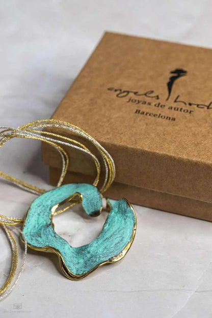 Eternal C Pendant necklace in gold-plated bronze with sculptural design