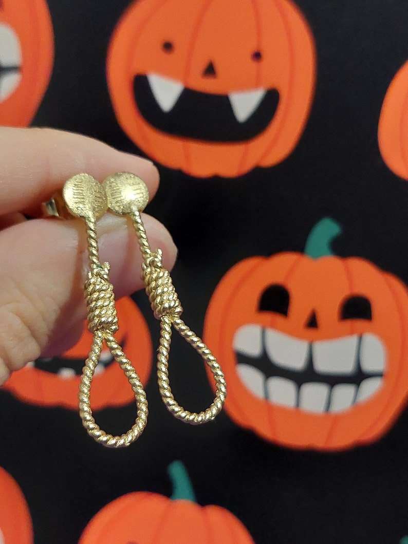 Gold rope-shaped dangle earrings with textured round tops and twisted coil teardrop loops
