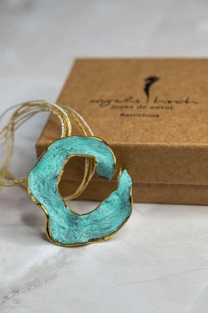 Eternal C Pendant side view with sculptural profile