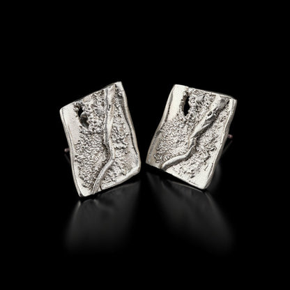 Silver square stud earrings with textured, layered pattern