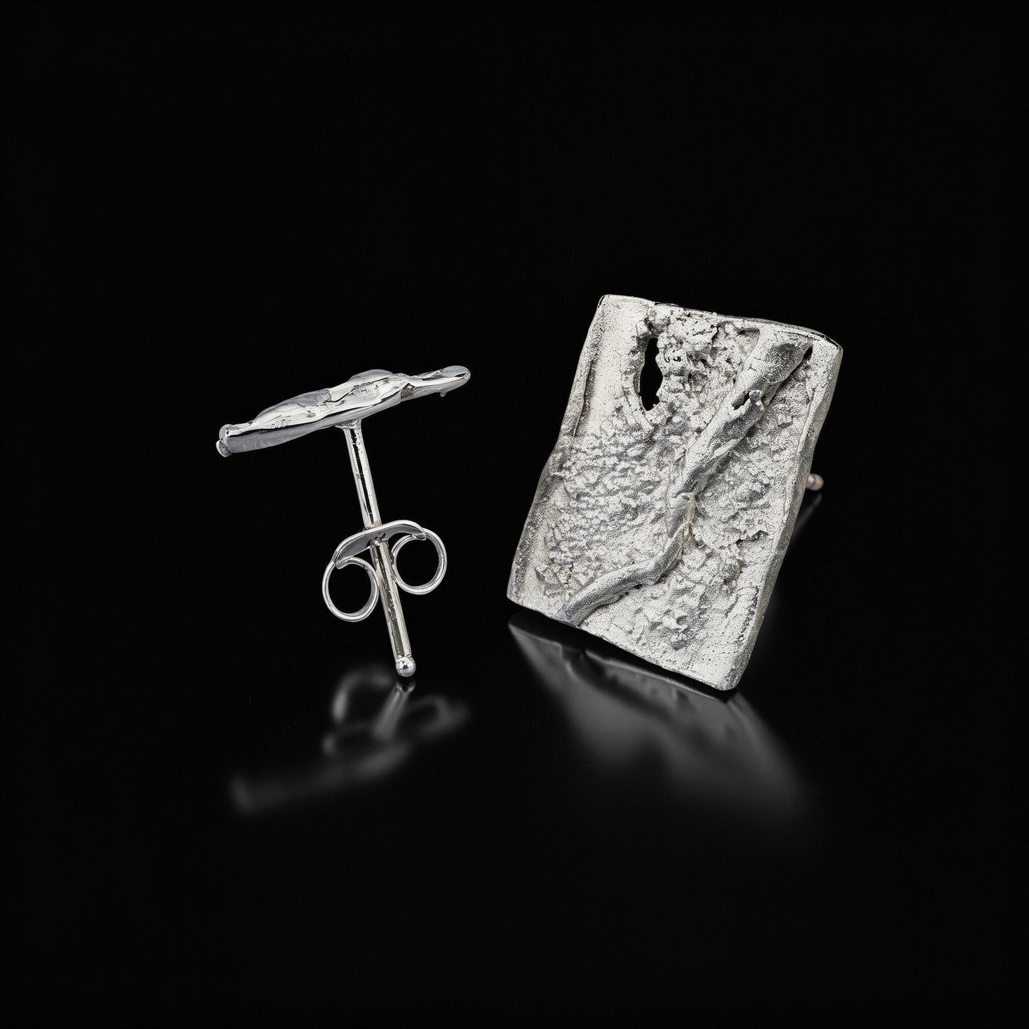 Silver square stud earrings with textured front and butterfly back detail