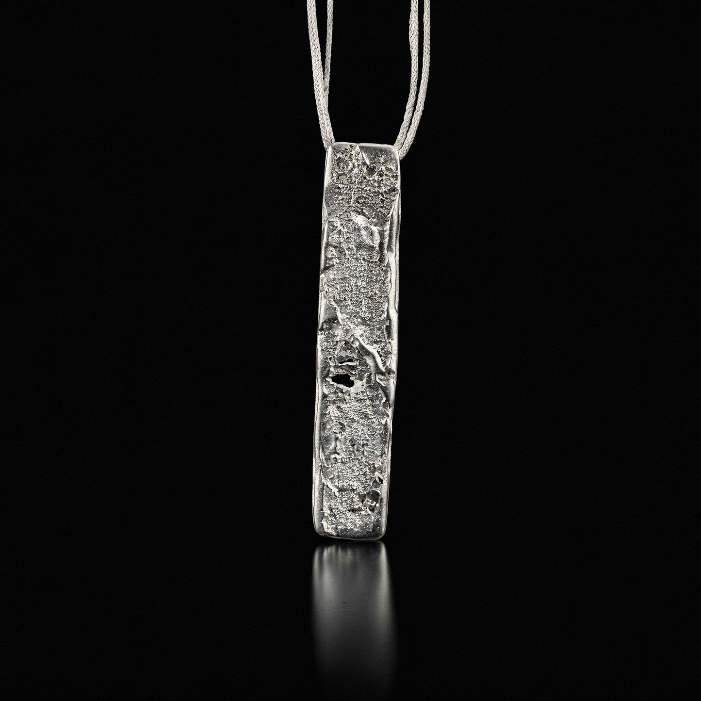 Silver strata necklace with rectangular hammered pendant on thin chain