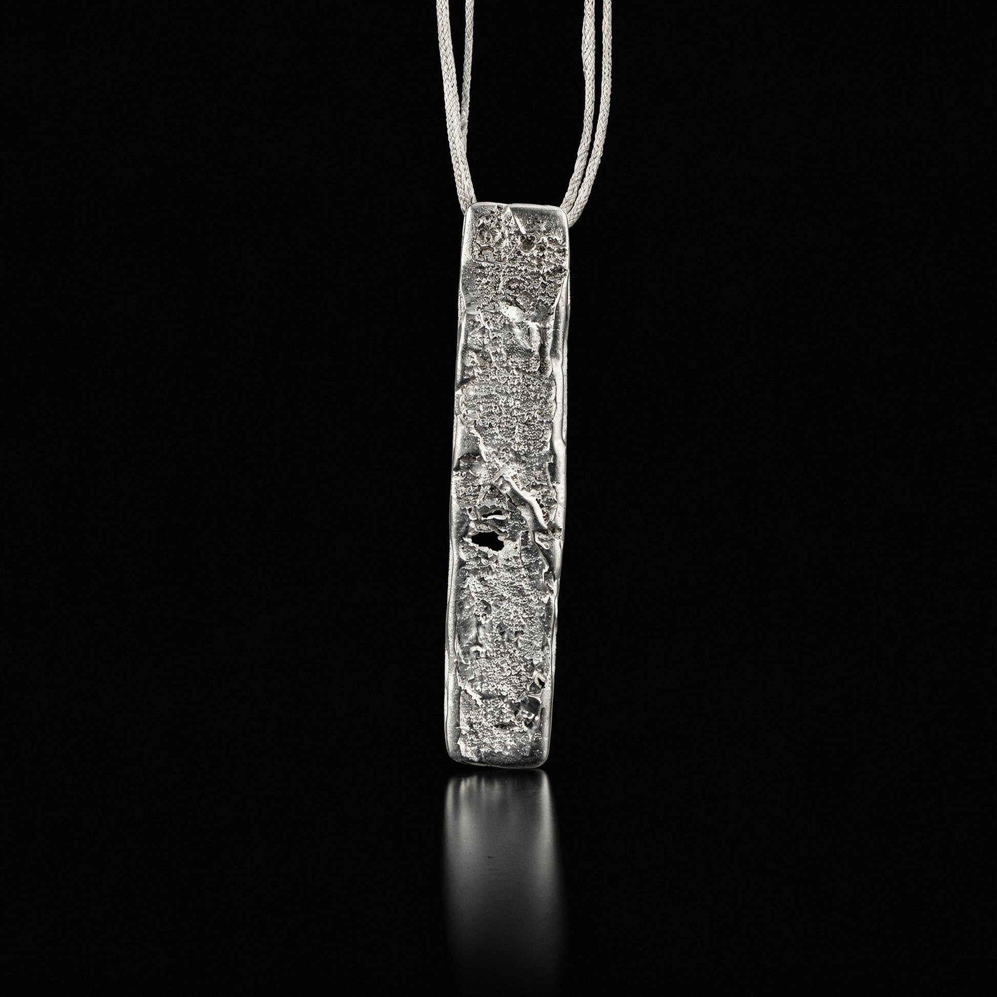 Silver strata necklace with rectangular hammered pendant on thin chain