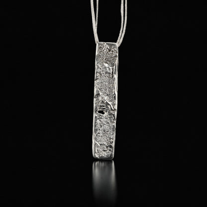 Silver strata necklace with rectangular hammered pendant on thin chain