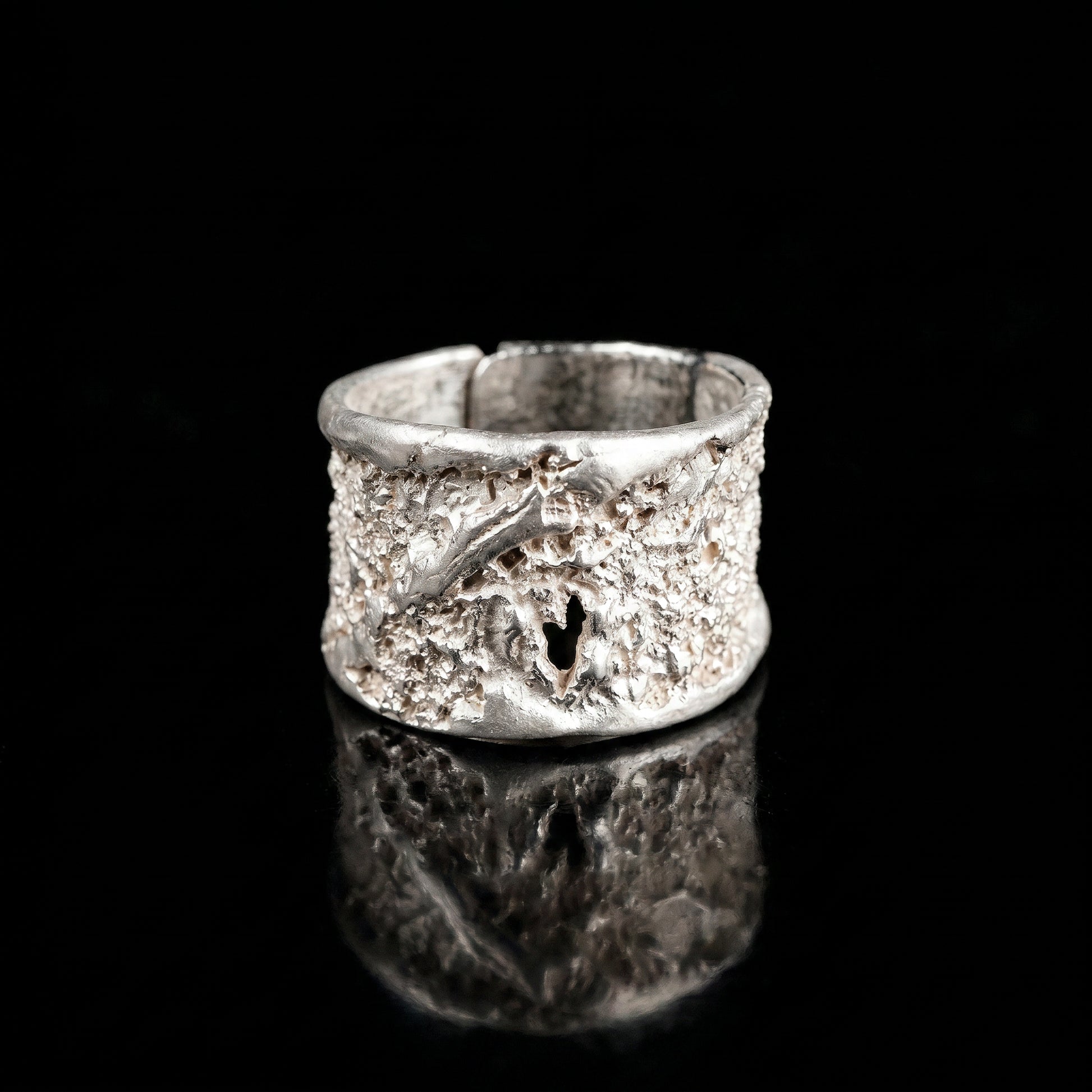 Silver strata ring with wide band and speckled textured surface, rounded top