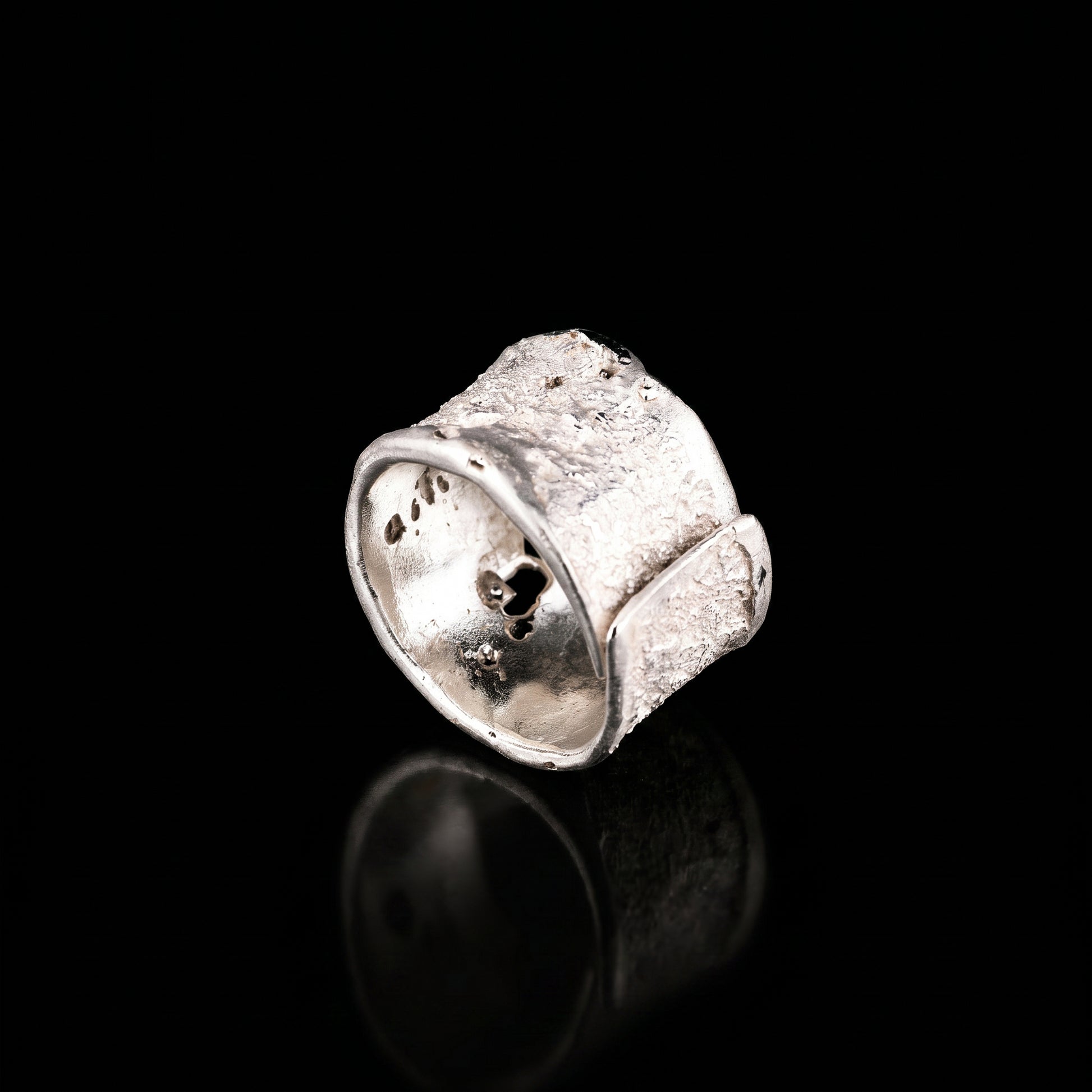 Silver strata ring with chunky square face, speckled texture, curved open shank