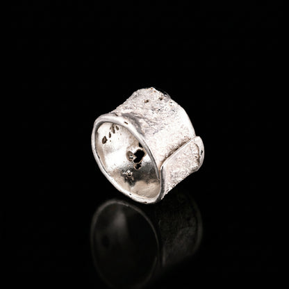 Silver strata ring with chunky square face, speckled texture, curved open shank